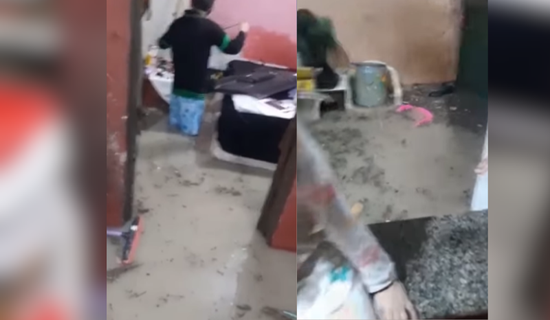mãe e filha choram com casa alagada em Manaus; VEJA